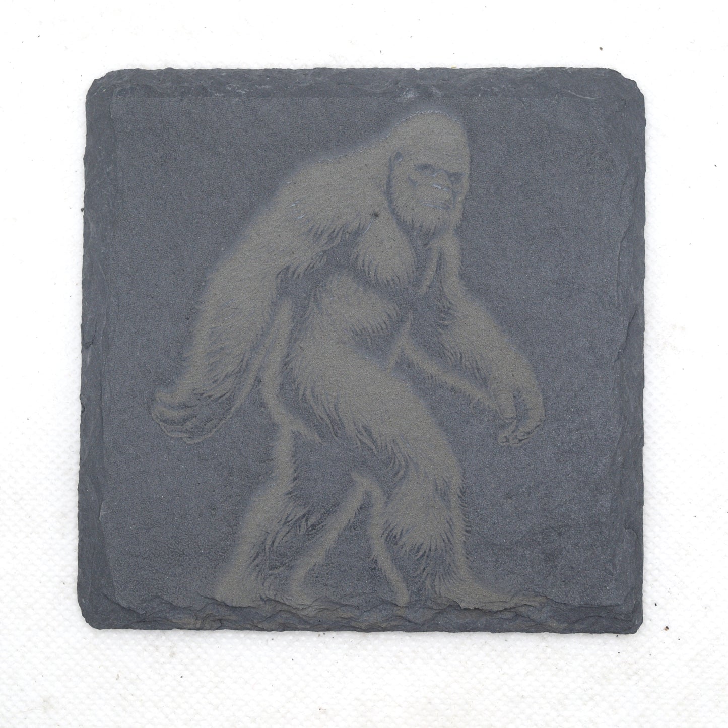 Coaster with Bigfoot engraved on it