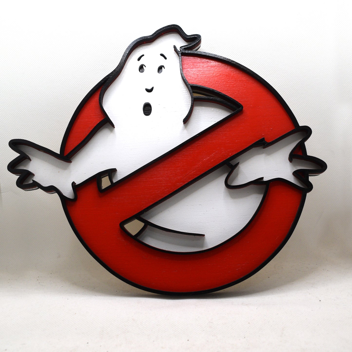 Ghostbusters logo with a ghost icon on a white background