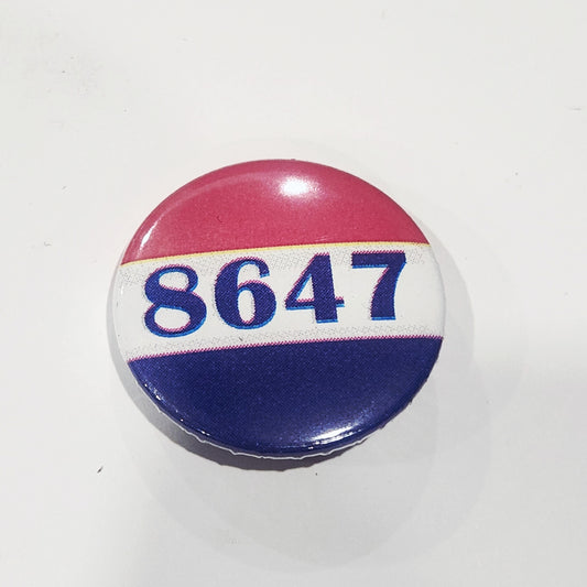 Button badge with numbers 8647 on a white background