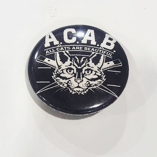 Button badge with a cat illustration and 'A.C.A.B. All Cats Are Beautiful' text on a black background