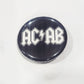 Button badge with 'ACAB' text on a black background