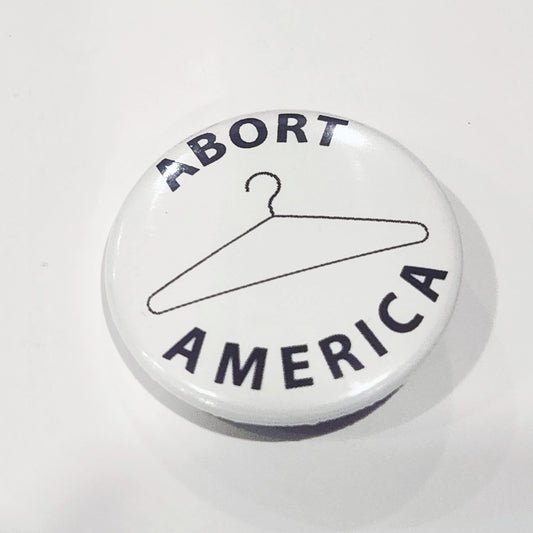 Button with 'ABORT AMERICA' text on a white background