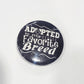 Button badge with 'Adopted is my Favorite Breed' text on a black background
