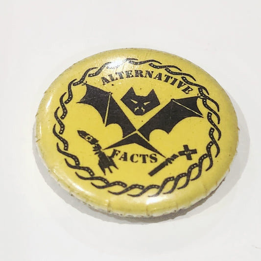 Round yellow badge with black text and symbols on a white background