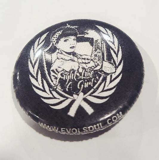 Button badge with 'Fight Like Girl' design and laurel wreath on a white background