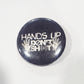 Button badge with 'Hands Up Don't Shoot' text 