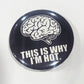 Button badge with brain illustration and text 'This is why I'm hot' on a black background