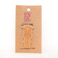 Tiki God 3 Wooden Lapel Pin on Evol Soul branded Card