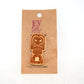 Tiki God 5 Wooden Lapel Pin on Evol Soul Branded Card