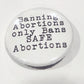 Button with text 'Banning Abortions only Bans SAFE Abortions' on a white background