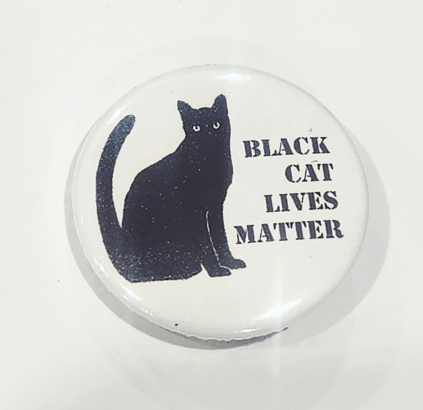 Button badge with a black cat illustration and 'Black Cat Lives Matter' text on a white background
