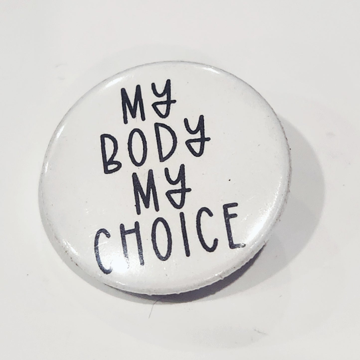 Button badge with 'My Body My Choice' text on a white background